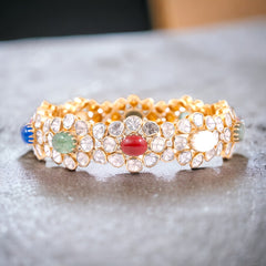 Radiant Navratna Bracelet with Halo Moissanite Polki Bangle: A Harmonious Fusion of Elegance and Sparkle, Crafted in Fine 925 Sterling Silver with 18kt Gold Plating