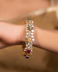 Radiant Navratna Bracelet with Halo Moissanite Polki Bangle: A Harmonious Fusion of Elegance and Sparkle, Crafted in Fine 925 Sterling Silver with 18kt Gold Plating